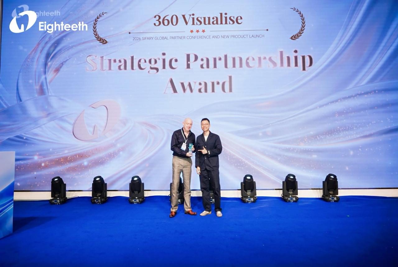 Simon Tao, Eighteeth's CEO, presenting the Strategic Partnership Award to Pete Donnelly of 360 Visualise on stage in front of a backdrop reading 2026 Sifary Global Partner Conference and New Product Launch