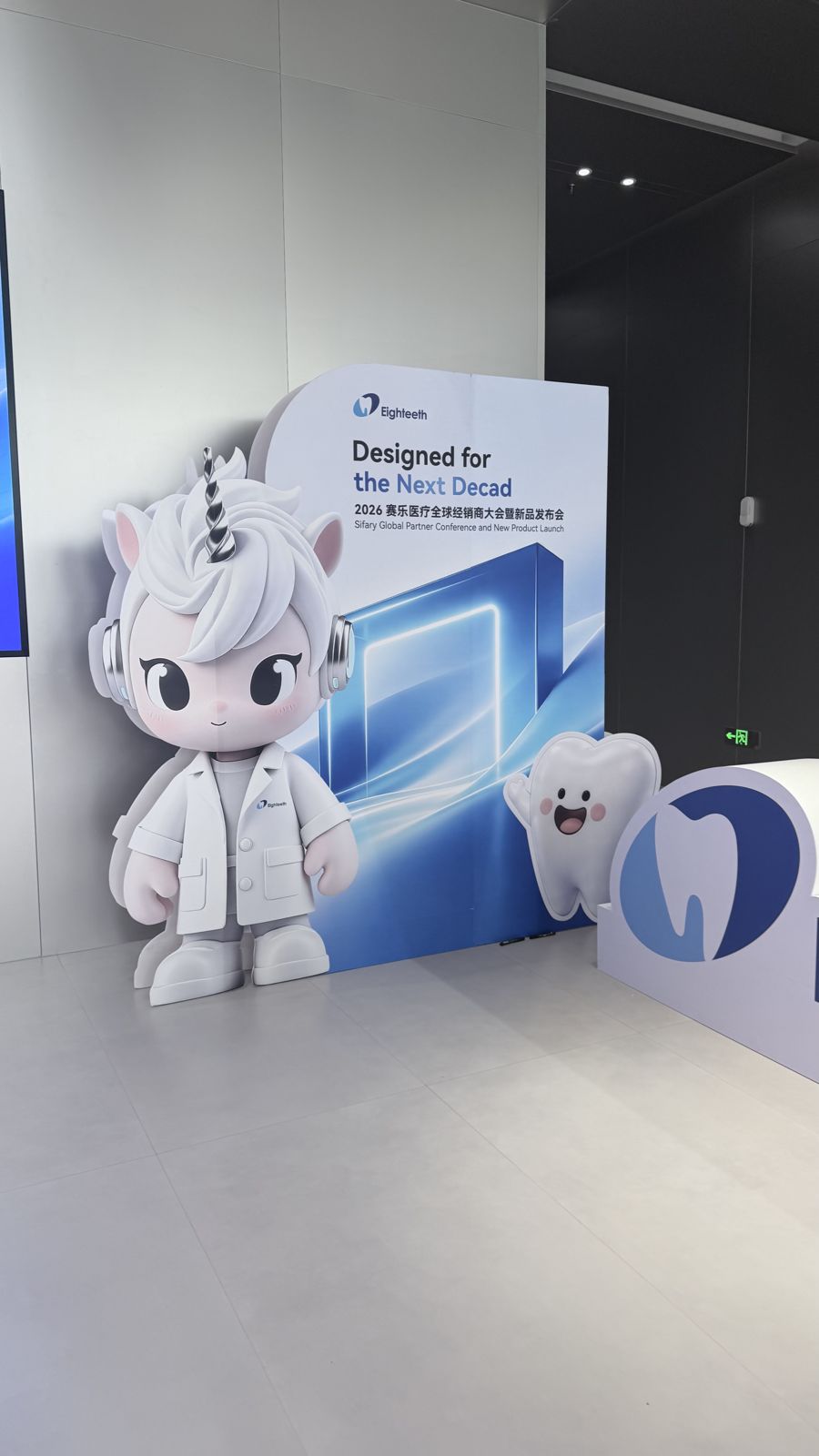Eighteeth mascot standee beside a sign reading Designed for the Next Decade, 2026 Sifary Global Partner Conference and New Product Launch