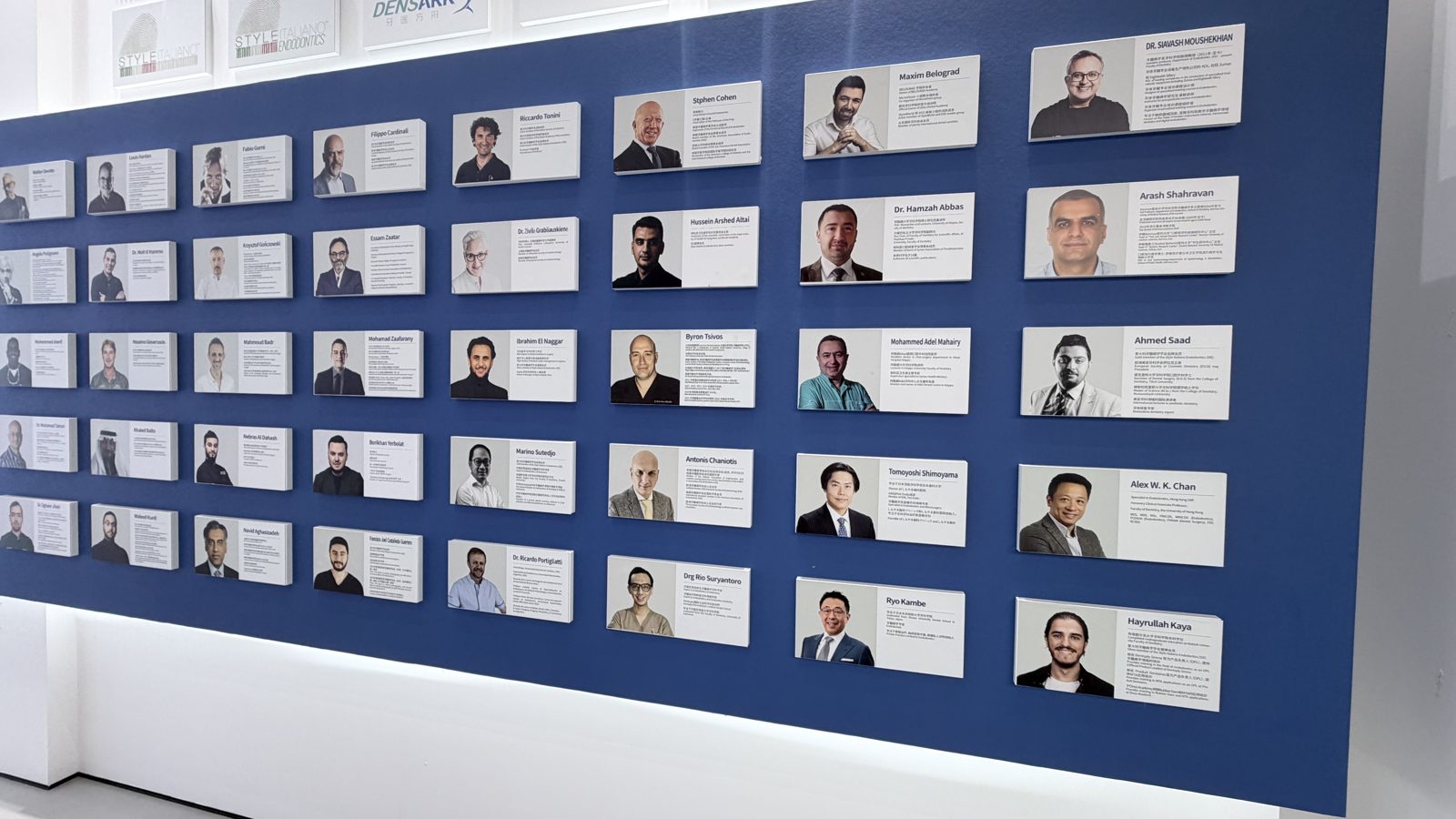 Eighteeth's wall of key opinion leaders, with portrait panels of dentists from around the world